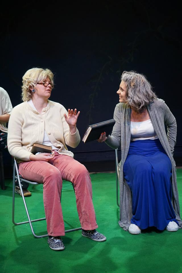 Binnie (Valentina Kolaric, R) tries to get Darla (Erin Holt, L) on topic.