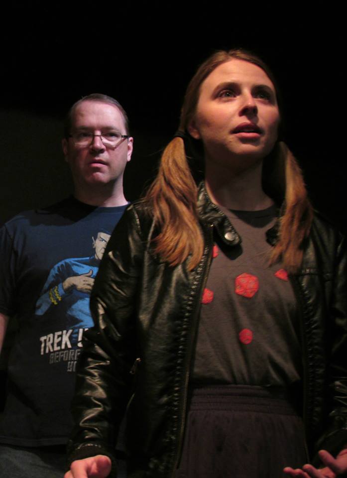 Debbie (Julia Griswold) begins to revel in the power of witchcraft as a fanboy friend (Erik Engman) looks on.