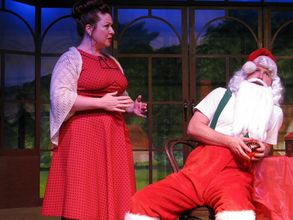Jessica Claus (Jennifer Christina Smith) is tired of Kris Kringle's (Scott Golden) self-centered grousing.
