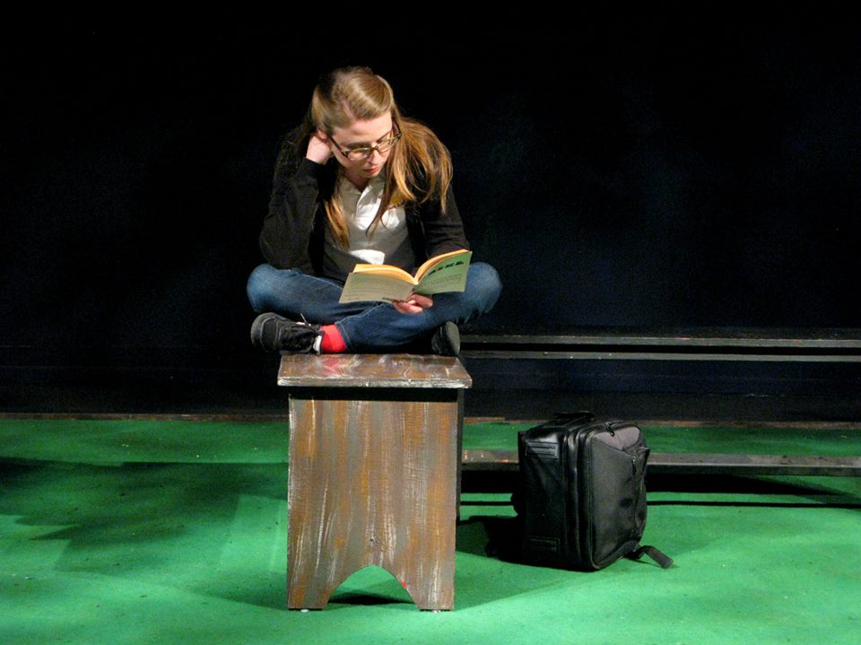 Nora (Julia Griswold) studies between classes.
