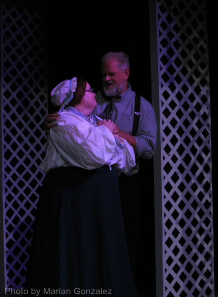 Marmie (Alyssa Preston) and Pa (Abraham Benrubi) in a loving embrace.