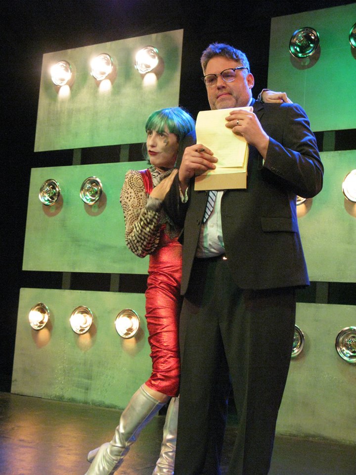 David Bowie (Mandi Moss) persuades Paddy to cast him as The Joker.