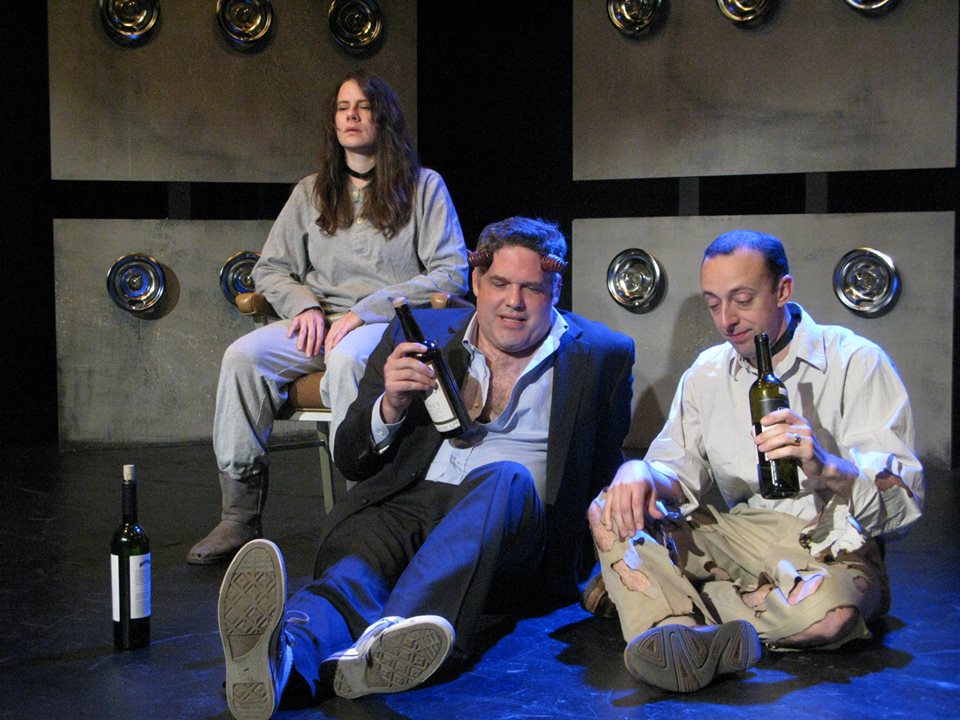 Goatish Asmodeus (Peter Fluet) gets drunk with Prescott.