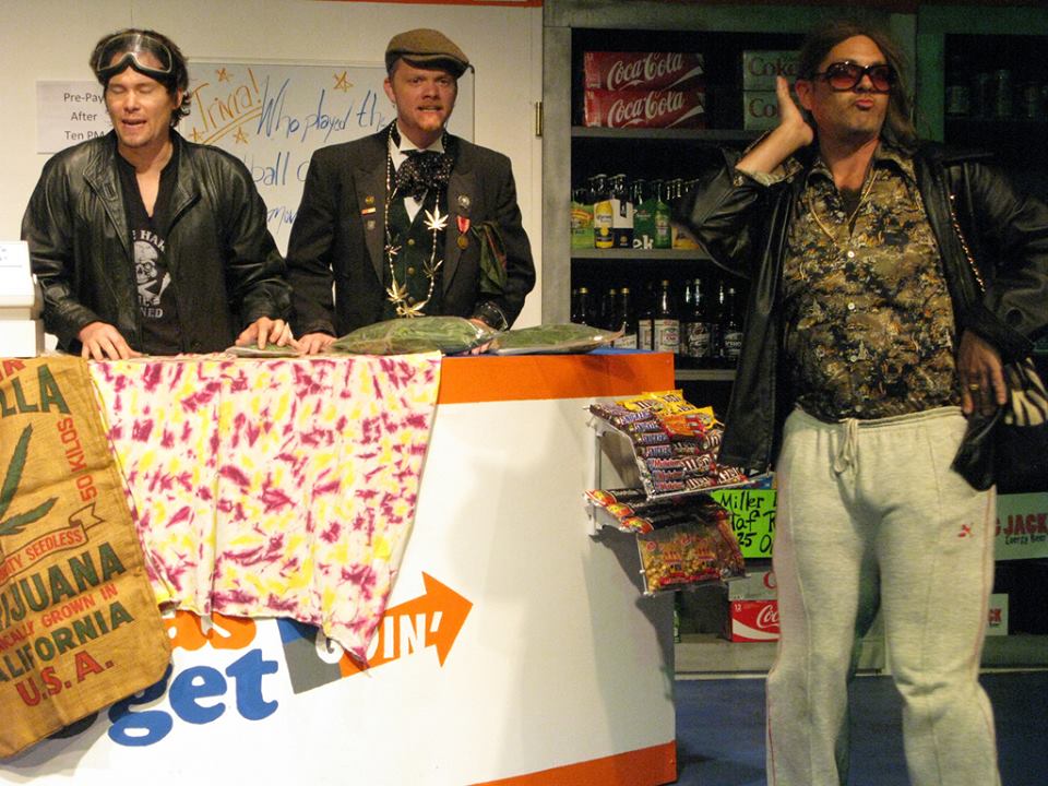 Holmes and Watts, while working at a weed dispensary, are hired by male model Wilson (Curt Bonnem).