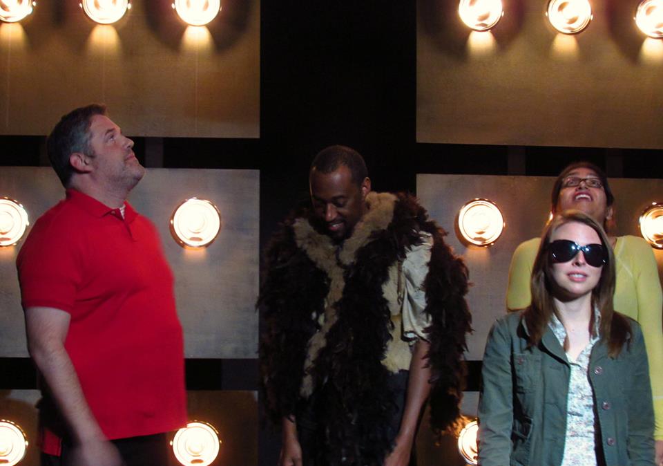 Peter and Marian are have an awkward celebrity encounter when they meet Mothra and Godzilla in the elevator on their way to the audition.