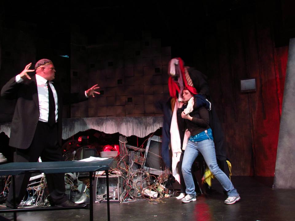 Mimblegast (Abraham Benrubi) tries to help Darcy (Erika Rose), who is a captive of the Laundry Golem (Aaron Francis).