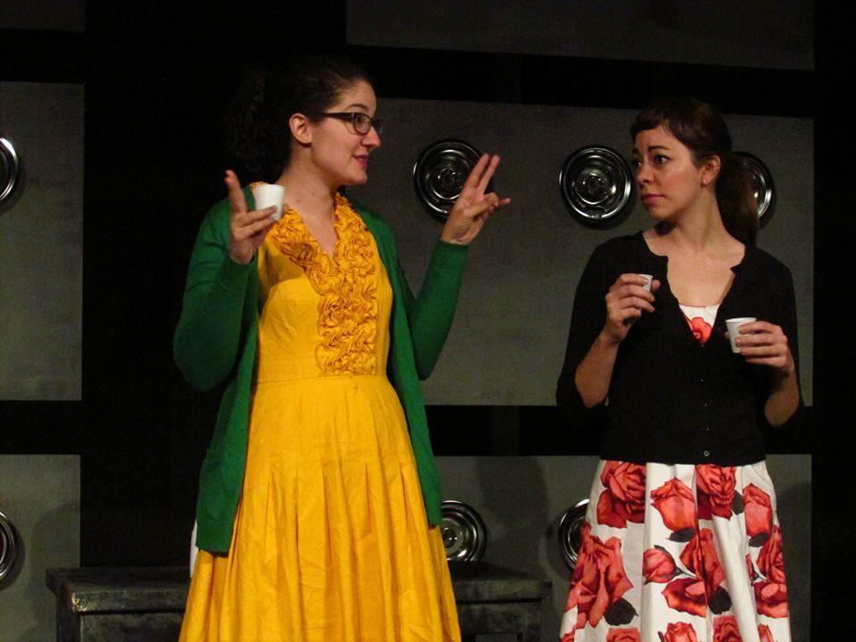 Connie (Aviva Pressman) and Sherry (Angela Sauer) aren't thrilled with how early the sock hop will be ending.