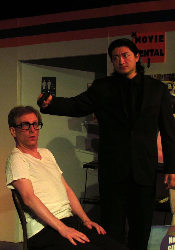 Judas (Corey Klemow) is held at gunpoint by James (Scot Shamblin).