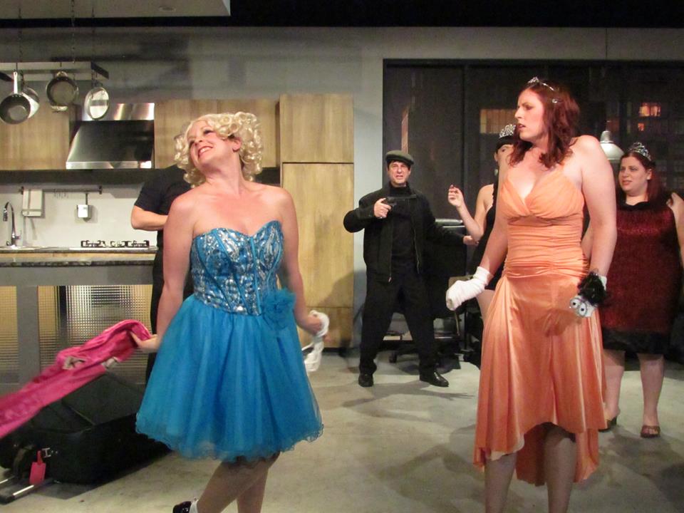 Splenda Boom-Boom (Shannon Nelson) reveals her true identity, as Violet (Erika Rose) looks on.