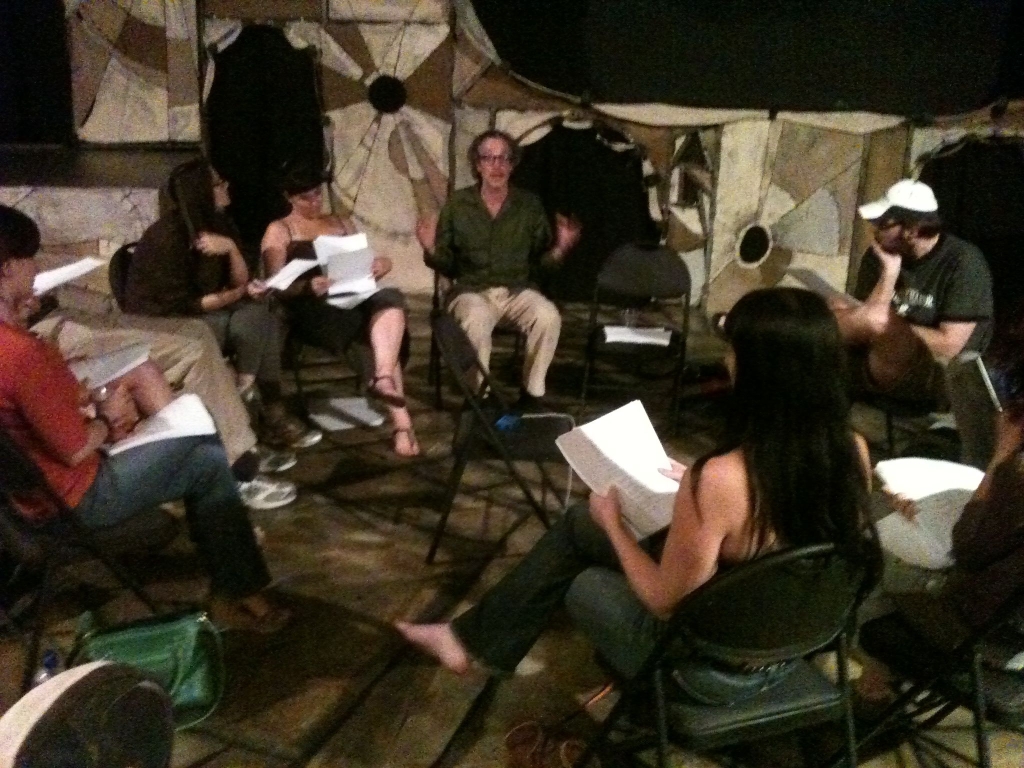 Co-author Terry Tocantins (center) talks to the actors at a rehearsal.