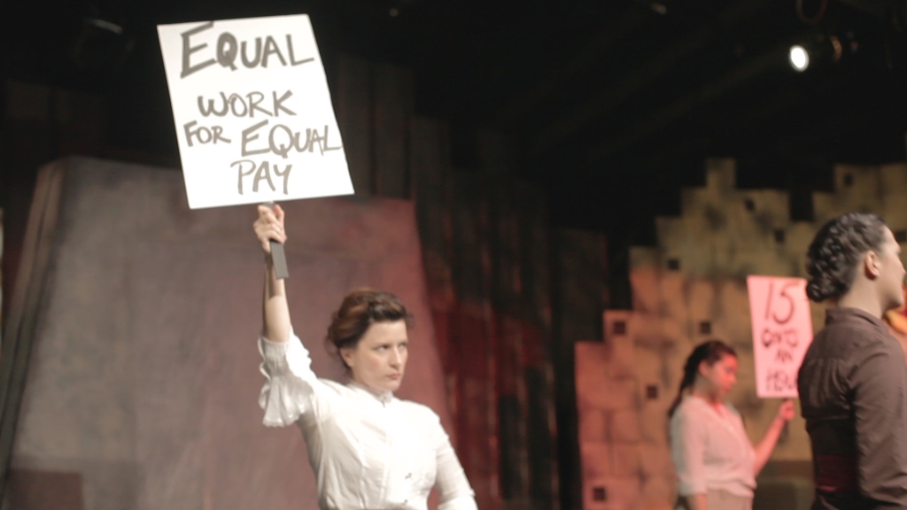 Shaela Cook as "Noreen," protesting at the Triangle Shirtwaist Factory